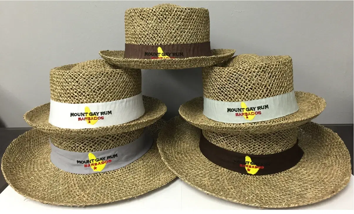 Five Mount Gay Rum Barbados straw hats stacked together